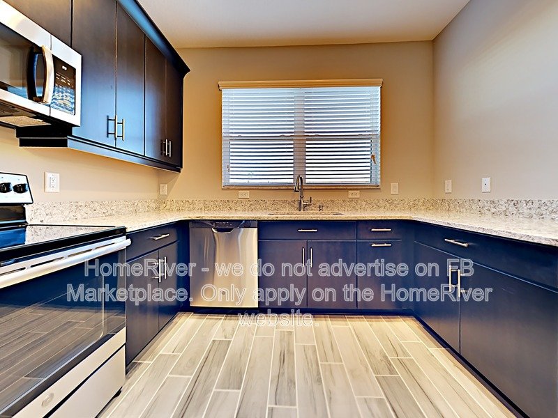 Gated Wiregrass Ranch Townhome | Pond View | Water Included property image