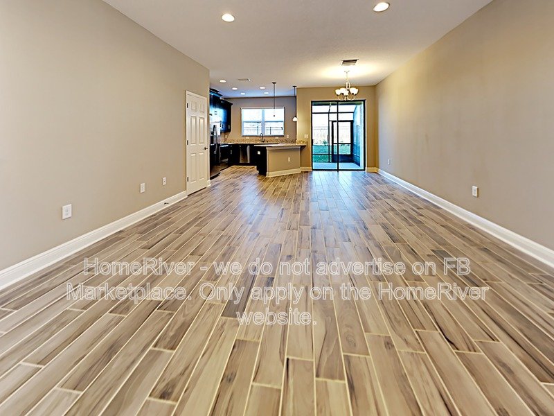 Gated Wiregrass Ranch Townhome | Pond View | Water Included property image