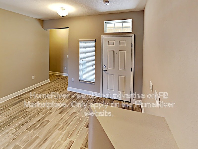 Gated Wiregrass Ranch Townhome | Pond View | Water Included property image