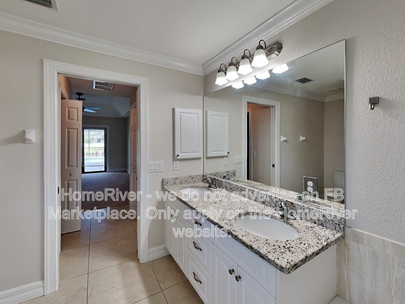 Poolside Paradise w/ Canal Views | 3BR + Screened Lanai property image