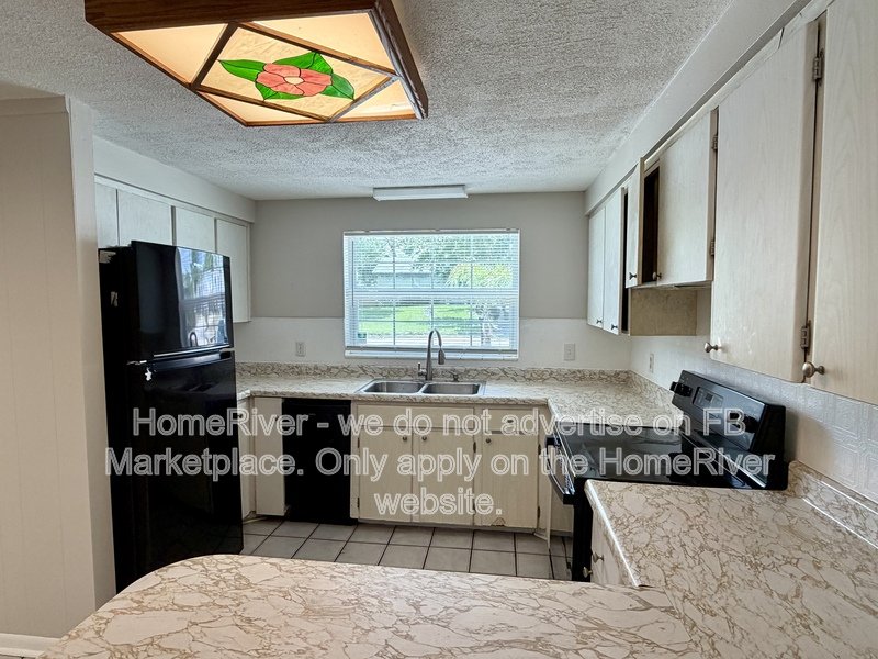 4 bedroom home with fenced yard and screened porch property image